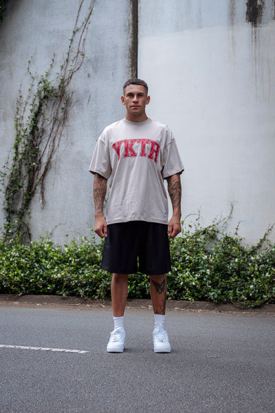 VARSITY O/S EMB TEE - STONE